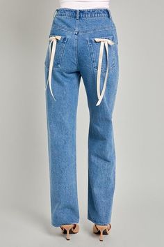 Light wash high waisted straight leg denim pants with bow detailing on back pockets! -Model is 5’8 and is wearing a small -Materials: 100% cotton