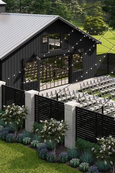 an aerial view of a barn with rows of chairs set up for a wedding ceremony