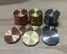 several different types of metal discs on a table