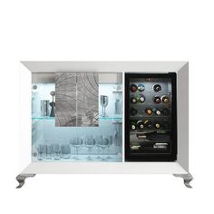 a white and black wine cooler with glass doors on the front is filled with glasses