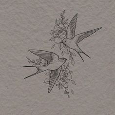 two birds are flying over some flowers on the side of a piece of parchment paper