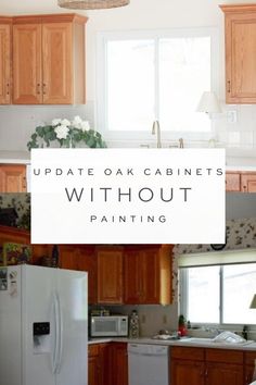 a kitchen with oak cabinets and white paint on the counter top, in front of a window that says update oak cabinets without painting