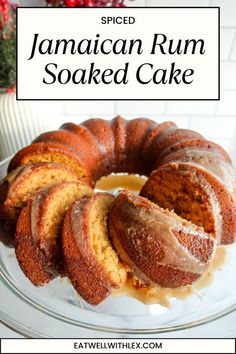 a cake on a plate with the words spiced jamaican rum soaked cake above it