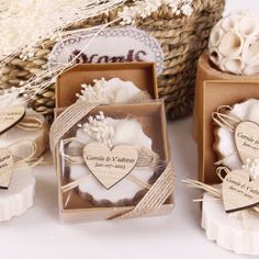 wedding favors and soaps are displayed in boxes