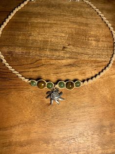 Elevate your style with the handmade hemp macrame spiral sun choker necklace! 🌿 This stunning piece is intricately crafted with love and positive energy, making it a unique accessory that will add a touch of bohemian charm to any outfit. 💫 Perfect for those who appreciate the art of handcrafting and sustainable fashion. ♻️ So go ahead, embrace your inner goddess and shine bright like the sun with our one-of-a-kind choker. Handmade Bead Necklaces, Granola Jewelry, Hippie Jewelry Aesthetic, Necklaces Hippie, Sun Choker, Hemp Choker, Spiral Sun, Hippie Sun, Boho Jewelry Bracelet