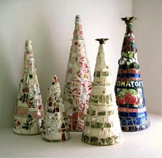 a group of ceramic trees sitting next to each other