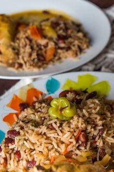 two plates with rice and vegetables on them