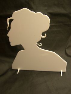 a white silhouette of a woman on a black background