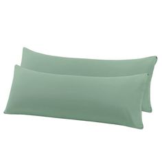 two light green pillow cases sitting next to each other