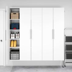 a white closet with shelves and bins filled with cleaning supplies next to a trash can