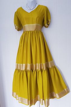 Festive Yellow Ruffled Dress, Summer Anarkali Dress With Ruffles, Fitted Anarkali Dress With Ruffles, Summer Silk Anarkali Dress, Silk Anarkali Summer Dress, Short Sleeve Silk Dresses For Festive Season, Short Sleeve Silk Dresses For Festive Occasions, Yellow Silk Dress With Short Sleeves, Festive A-line Silk Maxi Dress