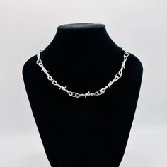 This chain necklace is smashing. Can be worn daily with any kind of outfit.

#barbwirenecklace #barbwiredesign #birthdaygift #anniversarygift #giftforeaster #moderategift Edgy Clavicle Chain Necklace For Gifts, Silver Punk Necklace With Adjustable Chain, Punk Style Silver Chain Link Necklace, Barbed Wire Necklace, Barbed Wire Chain, Emo Metal Chain Necklace, Punk Stainless Steel Necklace With Adjustable Chain, Punk Chain Link Necklace, Wire Choker Necklace