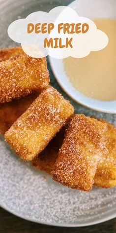 deep fried milk sticks on a plate next to a cup of tea