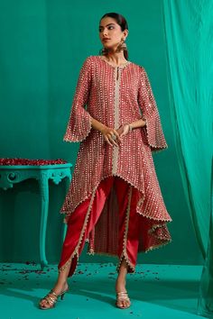 Coral asymmetric, ruffled panel kurta with all over mirror, pearl, thread embroidery. Paired with a tulip pant with pearl danglers. - Aza Fashions Tulip Suit Design, Georgette Suit Designs, Asymmetric Mirror, Cotton Suit Designs, Tulip Pants, Embroidery Mirror, Indian Designs, Red Kurta, Mirror Round