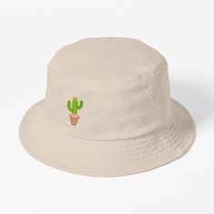 This packable, scrunchable, lightweight headwear classic is ready for adventure, from the beach to the street to the trail Breathable 100% cotton with eyelet ventilation Flat top Moderate brim is 2.2"" (5.5 cm) wide to keep the sun off your face Unstructured crown is 3.1"" (8 cm) deep Easy care: just spot clean and dry in shade. The perfect item or gift for a plant loving 80's and 90's kid. A beautifully illustrated succulent/ plant/ cactus using a pixel art style. Great for old school, retro gamers who also love plants. Cactus Bucket Hat, Retro Pixel Art, Plant Cactus, Kid A, Love Plants, Cactus Plant, Retro Gamer, Succulent Plant, Plant Design