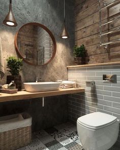 a bathroom with a toilet, sink and mirror on the wall next to a tiled floor