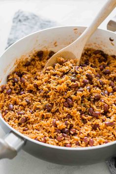 rice and beans are mixed together in a pot