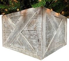 a wooden box with christmas lights on the top is shown in front of a white background