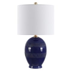 a blue table lamp with a white shade