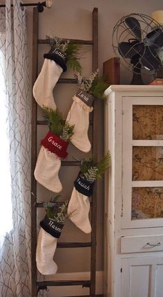 stockings hung on an old ladder in front of a window