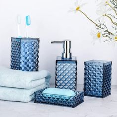 blue bathroom accessories with flowers in the background