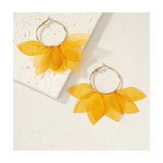 two pairs of earrings with yellow leaves on them