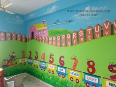 a child's room decorated with colorful wallpapers and numbers on the walls