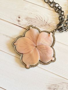 "🌸 Beautiful pink carved mother of pearl flower and diamond pendant. This pendant comes with a pretty coordinating sterling silver chain mixed in with wire wrapped pink agate beads. They coordinate perfectly. Statement piece - sure to receive compliments - love these feminine colors - you will feel beautiful wearing them Hand select all materials to ensure the best quality Length of the necklace - approximately 30\" - please message me if you would like a different length - as long as I have th Elegant Pink Mother Of Pearl Necklace, Luxury Pink Necklace With Pearl Pendant, Luxury Pink Flower Pendant Jewelry, Elegant Pink Jewelry With Large Pendant, Pink Diamond Necklace, Feminine Colors, Pearl Flower Necklace, Pink Pendant, Light Pink Flowers