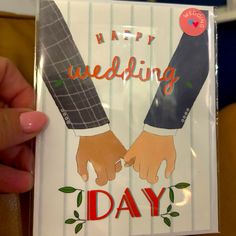 a card with two hands holding each other and the words happy wedding day written on it