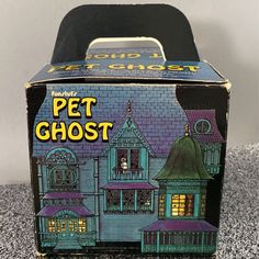 the box is open and has an image of a house on it's front