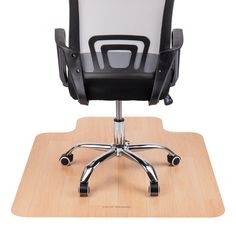 an office chair sitting on top of a wooden desk with black and white leather upholster