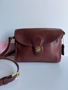 Classic Vtg Coach Devon Bag Burgundy currant color leather with brass hardware Roomy interior with zip pocket, outer slip pocket covered by a flap and secured with a turnlock Back slip pocket Adjustable 47" strap at longest Hang tag and chain Measures:10"L, 8"H, 3"W Made in the United States #0292-319 Flaw: dark stains on one side Cleaned, conditioned and ready to wear! Questions? Just ask More vtg coach styles/colors also available g117 Vintage Coach Luxury Satchel, Classic Flap Bag With Cc Turnlock Closure, Classic Travel Bag With Cc Turnlock Closure, Classic Brown Shoulder Bag With Cc Turnlock Closure, Classic Brown Bag With Cc Turnlock Closure, Classic Satchel With Cc Turnlock Closure For Formal Occasions, Classic Formal Satchel With Cc Turnlock Closure, Classic Shoulder Bag With Cc Turnlock For Daily Use, Classic Daily Use Shoulder Bag With Cc Turnlock Closure