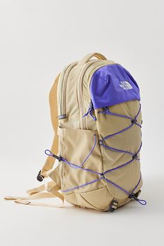 The North Face Borealis backpack is fitted with a FlexVent suspension system with a flexible yoke built from custom injection-molded shoulder straps, a padded mesh back panel and a breathable lumbar panel for an ultra-comfy feel at school, work or travel. Features The North Face Borealis backpack Lightweight backpack design Stand-up style 15" laptop sleeve Tons of flexible padding for comfort Padded mesh back panel Water bottle pocket Content + Care Recycled nylon ripstop with DWR finish Spot clean Imported Size 28L Dimensions: 13.25" l 9.75" w x 19.75" h | The North Face Borealis Backpack in Neutral, Women's at Urban Outfitters Backpacks For Back To School, Granola Backpack, Northface Backpacks, Backpack Must Haves, High School Backpacks, Backpacks Aesthetic, Backpacks For High School, Urban Outfitters Backpack, North Face Borealis Backpack