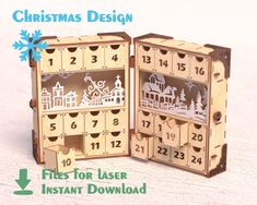 an open wooden box with christmas design on the front and side, showing it's contents