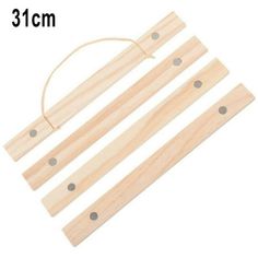 three pieces of wood with holes on each side and one piece cut out to show the length