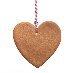 a heart shaped cookie hanging from a string