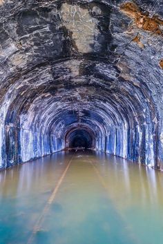 the inside of a tunnel with water in it