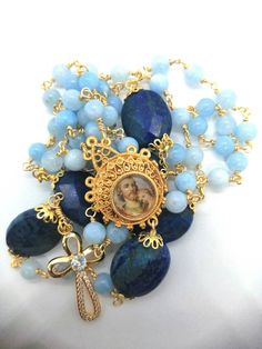 Beautiful Rosary dedicated to Saint Joseph, with 6 mm chalcedony beads and Pater in Lapis sfacetated 20 mm. The entire Rosary is hand-bound in Indian silver with the technique of knots to goldsmith that make it unbreakable. To see all the other Rosaries click here: labottegadelrosario.etsy.com Blue Spiritual Rosary With Gemstone Beads, Spiritual Blue Rosary With Gemstone Beads, Blue Gemstone Beads Rosary For Spiritual Use, Blue Gemstone Beads For Gifts, Blue Faceted Beads Gems And Cabochons For Gift, Blue Faceted Beads For Gifts, Beautiful Rosaries, Blue Rosary, Beautiful Rosary