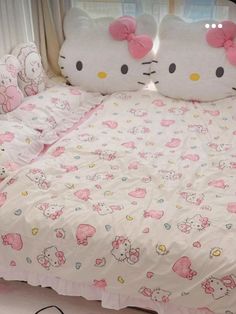 a bed with hello kitty sheets and pillows