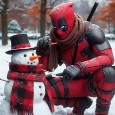 a man dressed as deadpool is next to a snowman