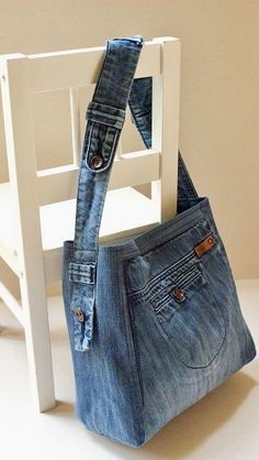 an old pair of jeans hanging from a white chair with the bottom part of it's pocket open