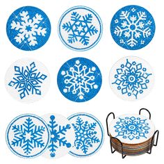 blue and white snowflakes are shown in the shape of circles on a table