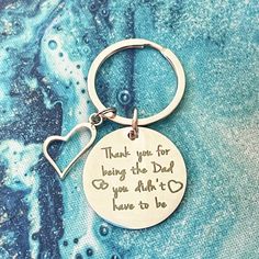 a metal keychain with a message on it that says, thank you for being the dad you didn't have to be