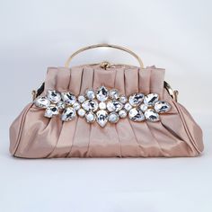 New to our Millennium collection, This beautiful romantic Rhinestone FLORAL bridal clutch bag is made of very fine quality of fabric and metal and it comes with chain 45 inches long for cross body bag and it's a Detachable chain for your Big day! measurements - bag is 8.5 inches height including top handle and without handle 6 inches. length of the bag is 11 inches and width of the bag is 3 inches. ► ABOUT YOUR ORDER * All items are neatly packaged in our beautiful jewelry boxes and elegant organza bags. * All items are 100% gift-ready. * Each order comes with a personalized handwritten card and a branded Millennium Bride jewelry cloth. * Each order comes with a free gift. ► PERSONALIZTION * If your order is a gift, you may contact us with the recipient's name or a message, and we'll print Elegant Embellished Clutch For Banquet, Elegant Embellished Evening Bag For Banquet, Embellished Clutch For Banquet, Beige Evening Bag With Detachable Handle, Elegant Embellished Bags For Banquets, Elegant Embellished Bags For Banquet, Elegant Embellished Bag For Banquet, Beige Handheld Evening Bag For Events, Rhinestone Clutch Evening Bag For Wedding Guest