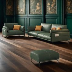 a living room filled with green couches and chairs next to each other on top of a hard wood floor