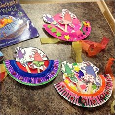 three paper plates are sitting on the counter next to some scissors and other crafting supplies