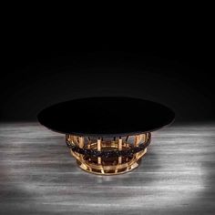 a black table sitting on top of a wooden floor