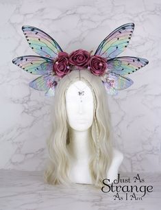 A real must-have statement crown for all fairies! A beautiful rainbow pink rose flower fairy headdress. The wings are lightweight and far more durable than their glassy appearance might suggest! They are backed with wire, which is what gives them their gorgeous curve. They are flexible to touch, and may be very slightly adjusted to give a deeper/more shallow curve. The headdress is decorated with pink roses and blossoms. Clear gems hang over the forehead from a silver chain. The ends of the head Whimsical Pink Crown Headpiece, Whimsical Pink Hair Accessories, Fairy Headpiece, Festival Fairy, Wings Fairy, Fairy Festival, Pink Rose Flower, Swarovski Beads, Fantasy Costumes