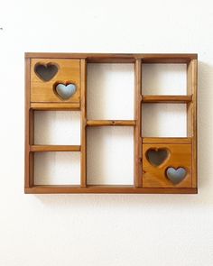 a wooden shelf with hearts cut out of it