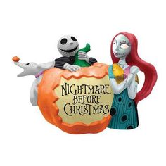 the nightmare before christmas ornament is shown with jack and sally on top of an orange